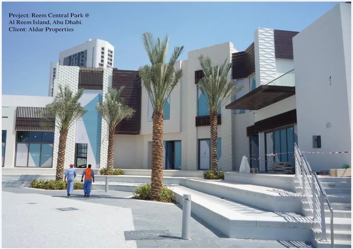 Reem Central Park at Al Reem Island, Abu Dhabi, with pale GRC cladding and palms